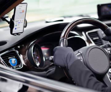 The driver behind the wheel and the mobile app